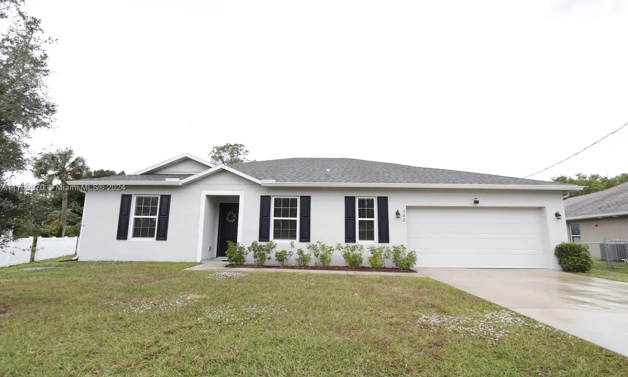 702 SW Aster Rd, Port St. Lucie FL 34953