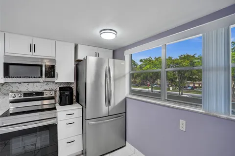 6075 N Sabal Palm Blvd # 212, Tamarac FL 33319