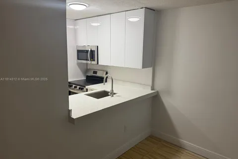 496 NW 165th St Rd # 210, Miami FL 33169