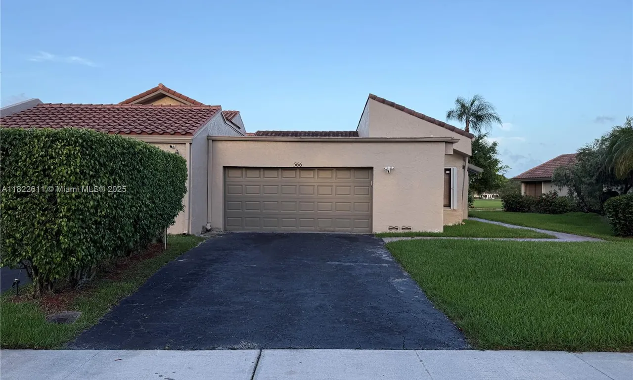 566 VILLAGE LAKE DRIVE, Weston FL 33326