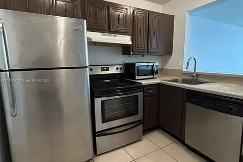 496 NW 165th St Rd # 310, Miami FL 33169