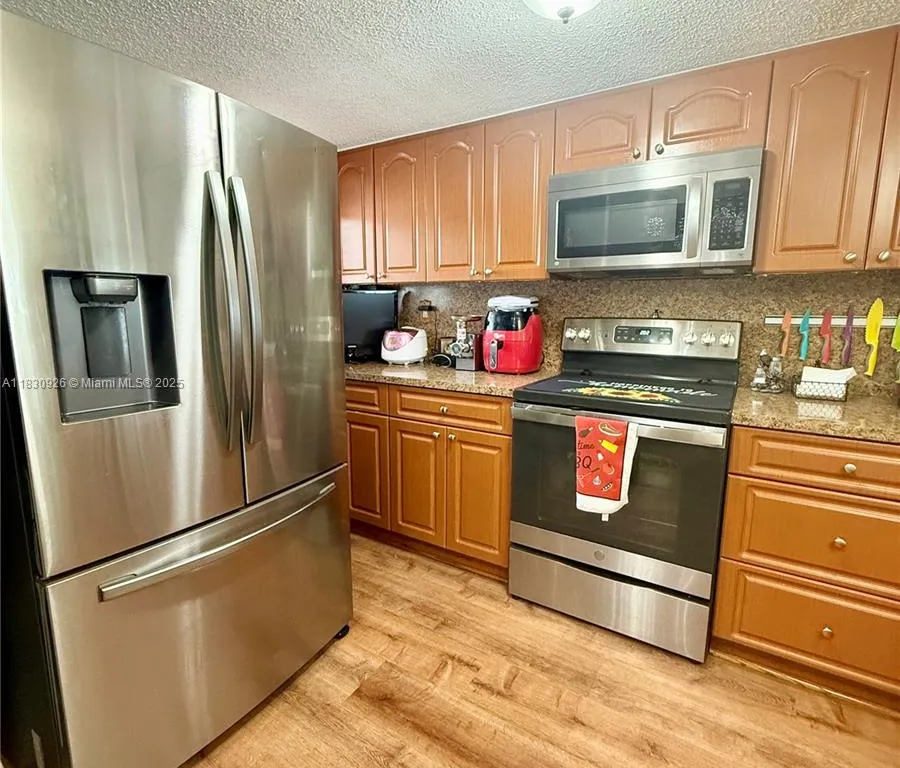 9917 W Okeechobee Rd # 201, Hialeah Gardens FL 33016